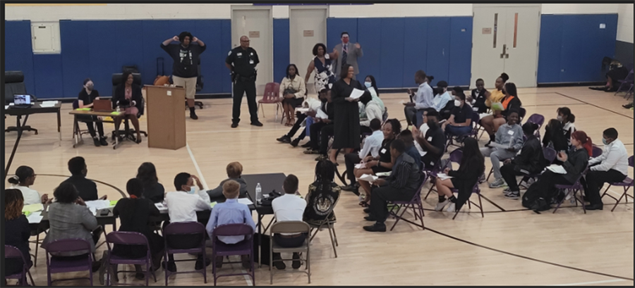 Carver Middle School Students and Local Community participating in a mock trial for Law Week